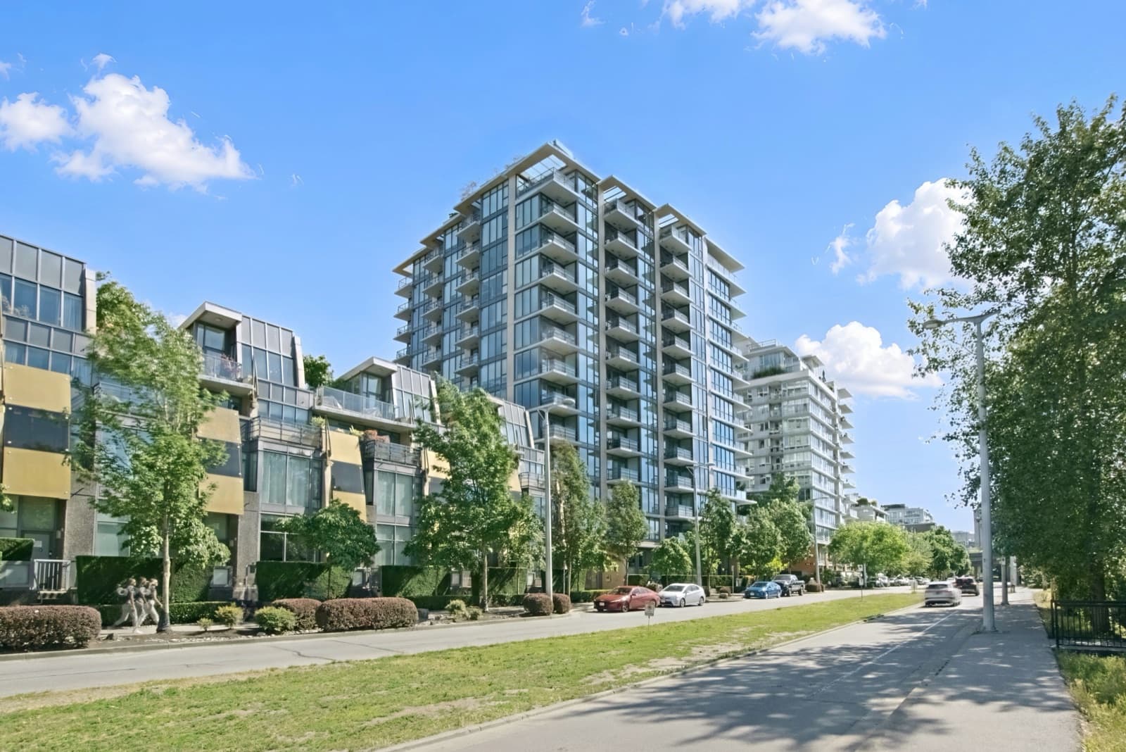 Condo towers on a tree-lined street